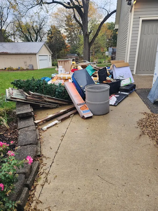 Dumpster being loaded with debris for Commercial Dumpster Rental in Verona Walk